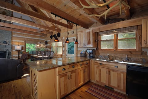 Fully stocked kitchen with high-end granite tops and appliances