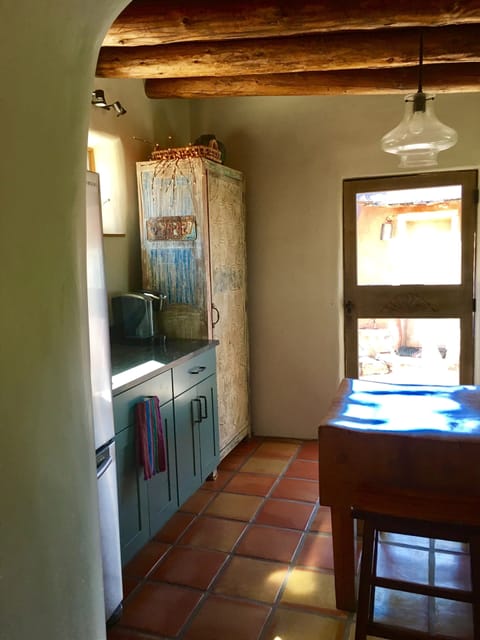 Thick adobe walls keep house cool in summer, warm in winter