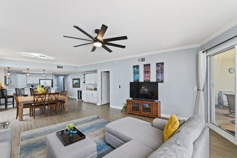 Living room; 60" 4k Roku TV, oversized sectional sofa. Oversized dining table. 