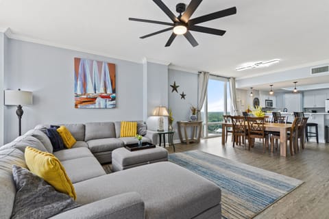 Living room; 60" 4k Roku TV, oversized sectional sofa. Looking at over sized dining table, easily seats 8 or more. 