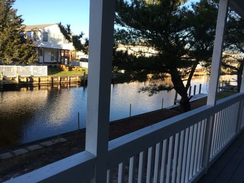relax on the rear screened in porch overlooking the canal waters