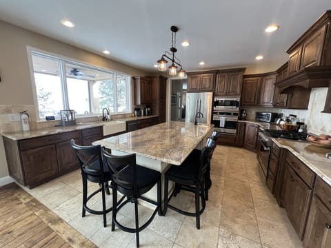 Kitchen complete with two ovens, five burners, microwave, and more