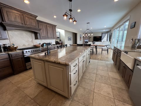Kitchen with two sinks, refrigerator with water dispenser and ice maker