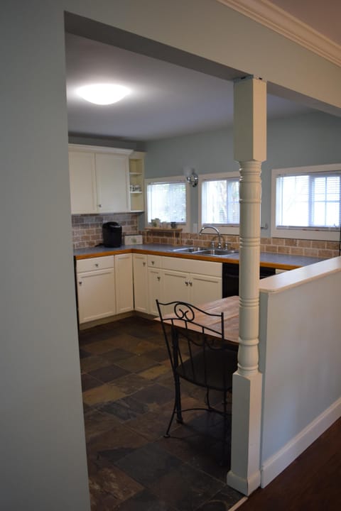 Kitchen has plentiful counter space and additional seating for two!
