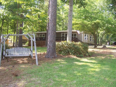 View of front of the cottage;  cozy wooded lot, 175 feet of water frontage.