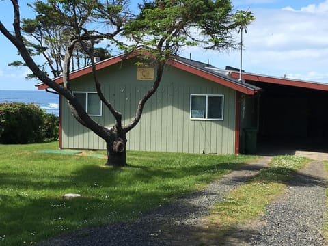 Front exterior with carport on east side of the house.