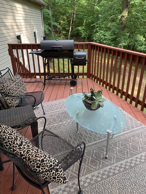 Back deck feels like you are in a  treehouse
Seating areaplus charcoal grill