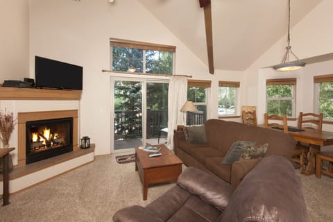 Main level living area with smart TV and gas fireplace.