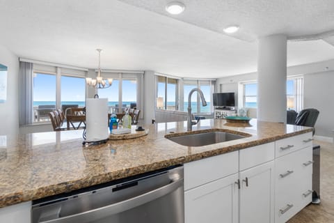 Kitchen overlooking into dining room and living room