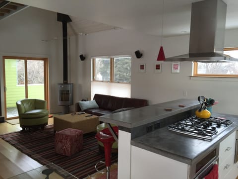 Looking from the dining table into the living area.  Wood stove!