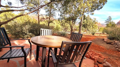 Flagstone patio with table and chairs.