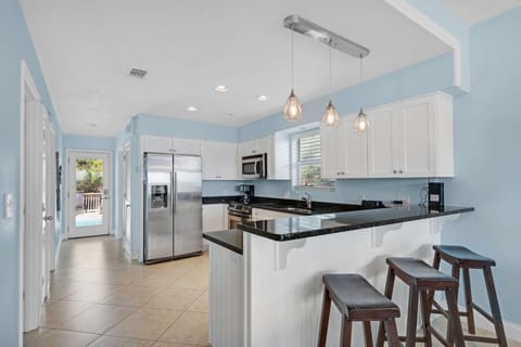 Open kitchen with door to the pool!