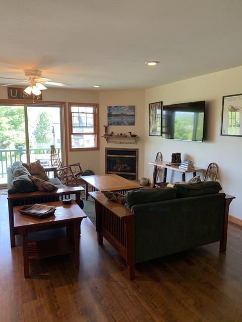 Living area with sliding glass door to front deck.