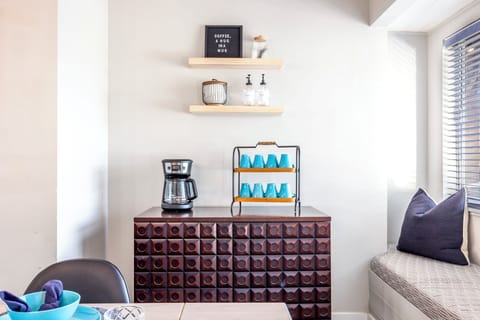 Our coffee station is located near the dining table. Drip coffee maker provided