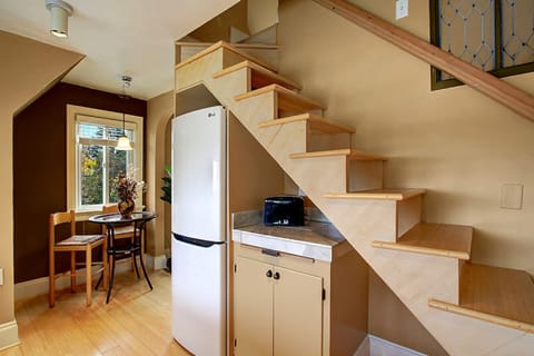 Stairs to second floor loft queen bed and sitting area