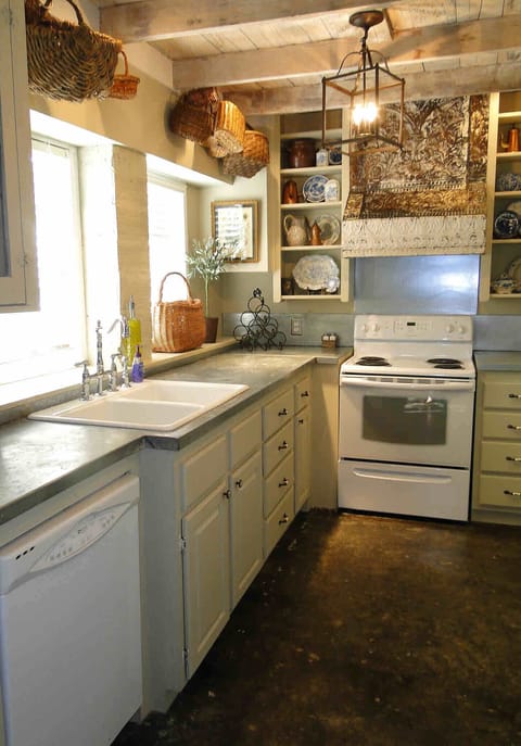 Full kitchen amenities: stove, range,refrigerator with freezer and ice maker.