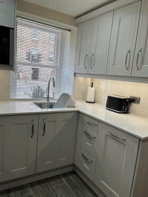 Kitchen window overlooking University buildings. Coffee shop directly opposite.
