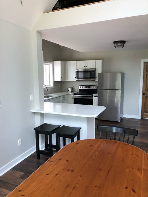 Fully stocked kitchen with breakfast bar