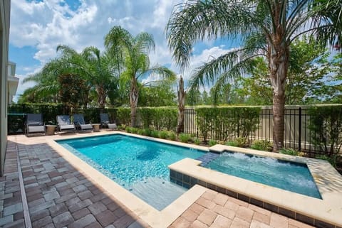Private Pool & Spa: Refresh and unwind in your private pool and spa, surrounded by lush greenery and comfortable loungers. The perfect setting for sunny Florida days and peaceful evenings under the stars.