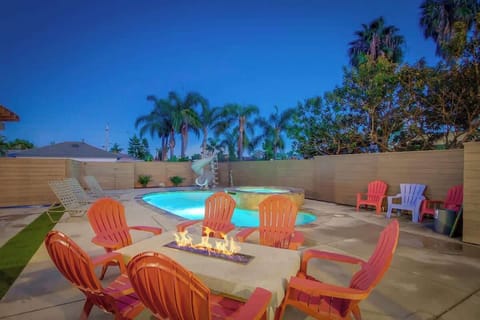 Gather around the fire pit for cozy conversations and good times, just steps away from the pool. The perfect spot to relax and unwind!