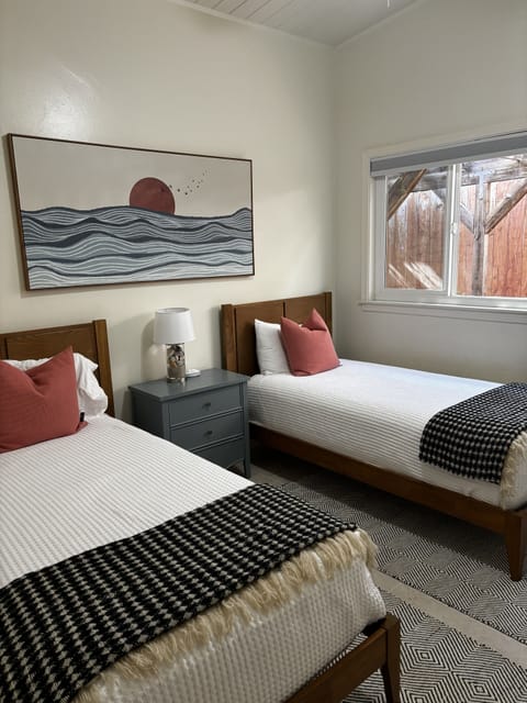 Comfortable twin bedroom  with new beds and updated furniture. Dresser in closet