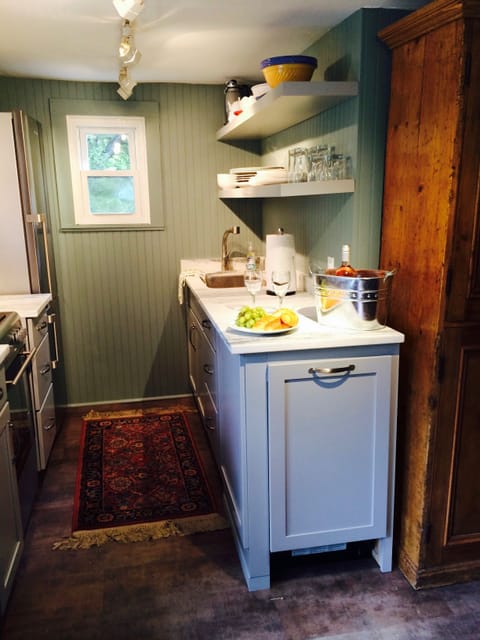 The new galley kitchen is ready for guests.  Can you see the dishwasher?
