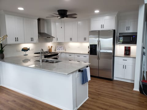 Recently renovated kitchen with stainless-steel appliances.