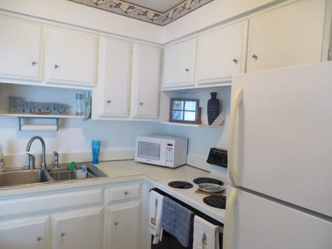 Open concept kitchen with breakfast bar.