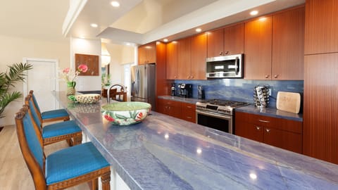 The modern galley kitchen comes fully equipped, including a large wine cooler.