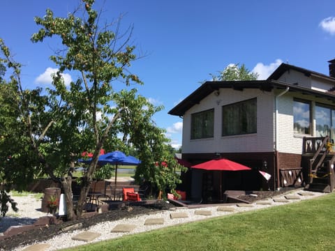 Have a sit on the patio while enjoying a glass of wine under the umbrella.