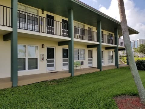 Unit is the 2nd from the end, FIRST floor (see chairs)
