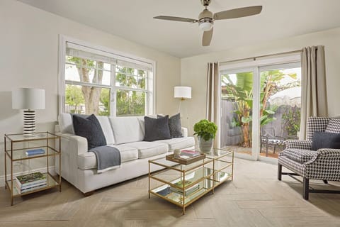 Unwind in a bright living room w/ a Queen sleeper sofa and a view of the patio.