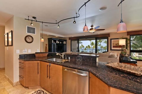 Fully equipped kitchen with breakfast bar and open layout.