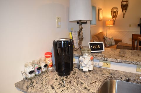 K-cups, sugar, creamer, tea, and hot chocolate provided.