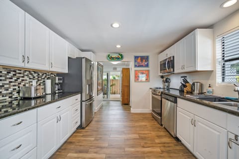 Kitchen leads to Florida room, laundry room & 4th bedroom with its own bathroom