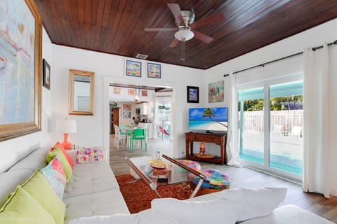 Living room/media room overlooks the pool deck