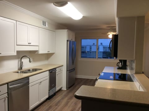View of kitchen from dining table.
