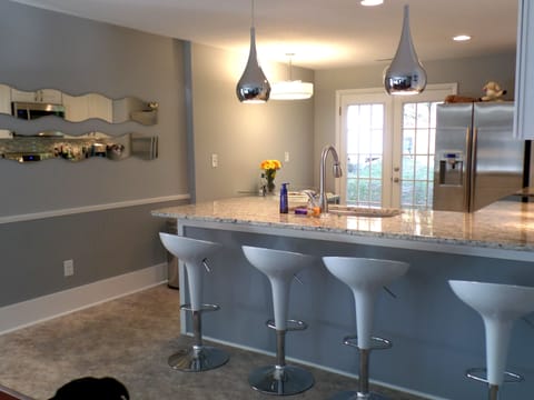 Granite counter tops provide a large, clean work surface.