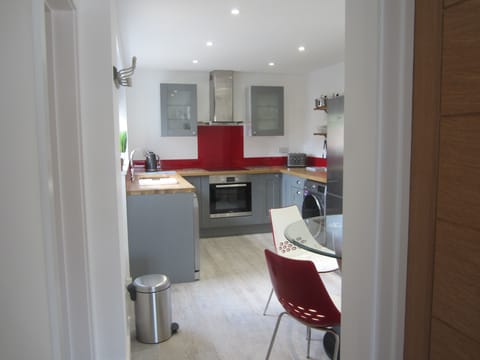 Small Garden at Back of Property with table and two chairs. on decking.