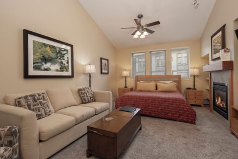 Your cozy studio awaits with a warm fireplace, plush seating, and everything you need for a restful mountain retreat.