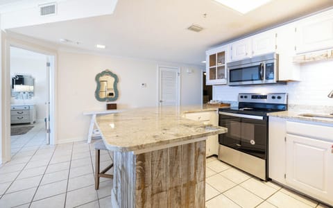 Gather around the spacious kitchen, perfect for casual meals and enjoying the inviting decor throughout