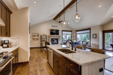 Prepare meals in the kitchen and take a seat at the breakfast bar.