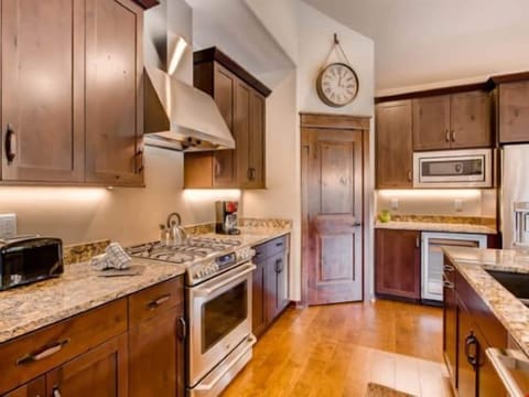 Prepare meals in the kitchen and take a seat at the breakfast bar.