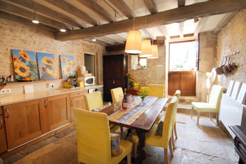 Eat-in kitchen has a Dutch door to garden.