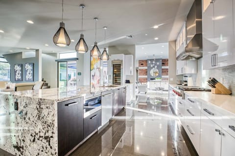 Modern kitchen located off the between the formal living room & TV room 