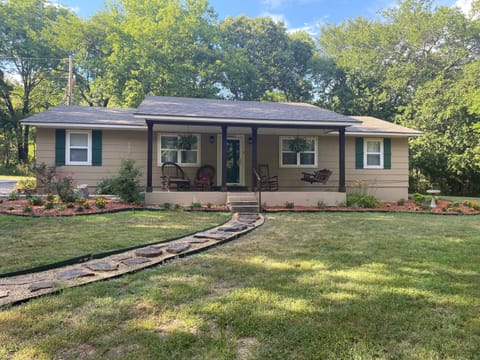 Front of Woodlands with flower beds and walkway