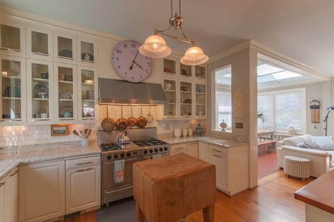 Gourmet kitchen with granite counters, fine French copperware