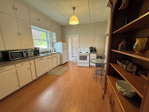 Well-equipped kitchen leads to open dining and living room. 