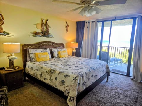 master bedroom bed with balcony in background