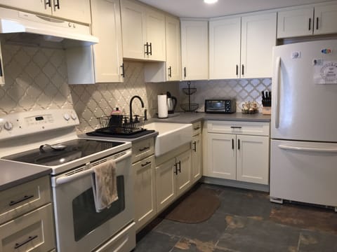 Kitchen with Stove, Refrigerator and Table for 6-8 People 